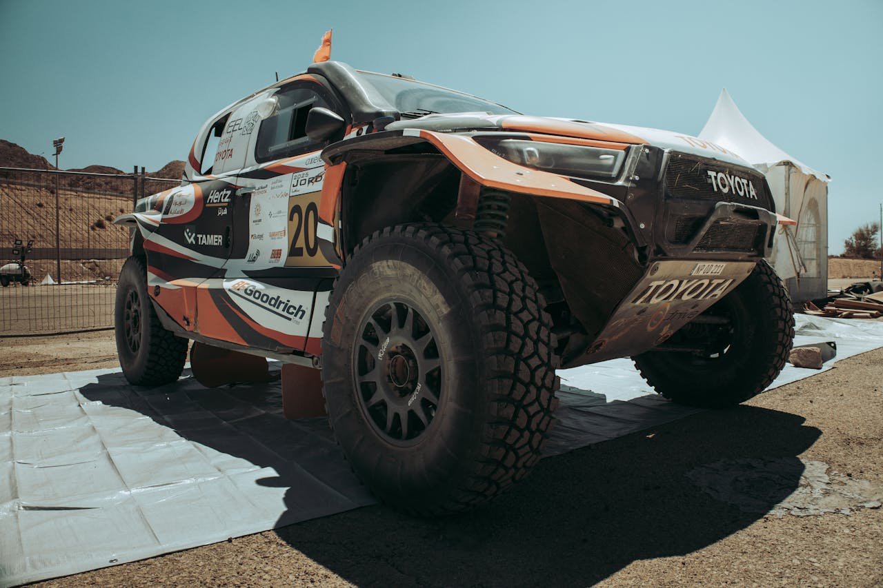 Close-up of a Toyota rally car ready for action in Aqaba, Jordan, showcasing its rugged modifications.
